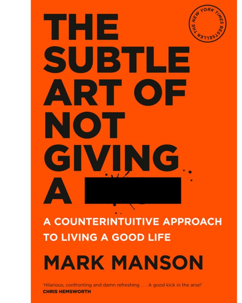 Untitled design (17) "The cover of the book 'The Subtle Art of Not Giving a F*' by Mark Manson. The background is bright orange with bold black and white text. The title is in large uppercase letters, with part of a word censored by a black rectangle. A circular stamp in the top right corner indicates that it is a New York Times bestseller. A quote at the bottom from Chris Hemsworth describes the book as 'hilarious, confronting, and damn refreshing.'"