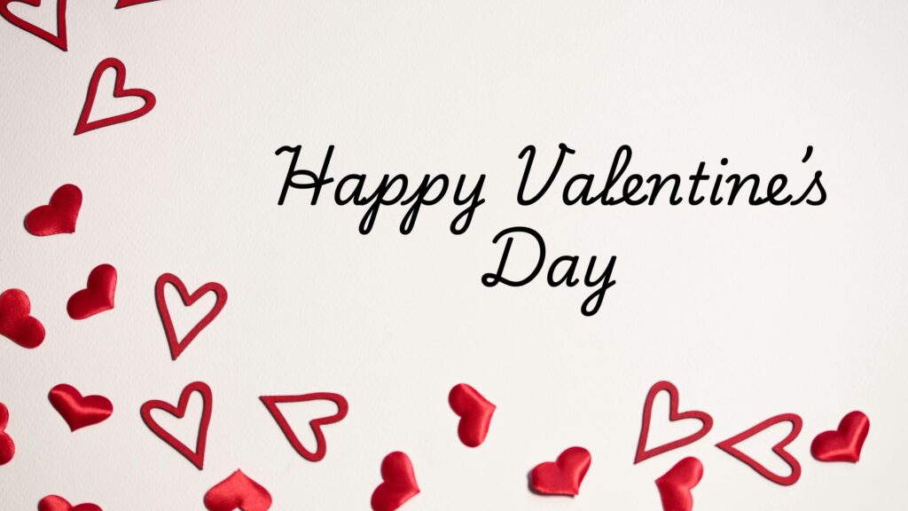 White background with the words ‘Happy Valentine’s Day’ written in elegant black script, surrounded by scattered red heart shapes and heart cutouts along the edges.”
